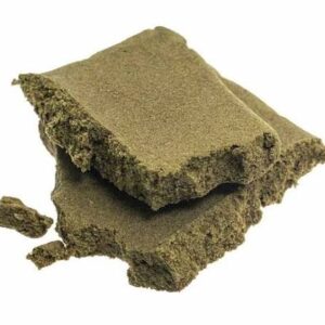 Moroccan hash blocks with crumbly texture and light brown color isolated on white background